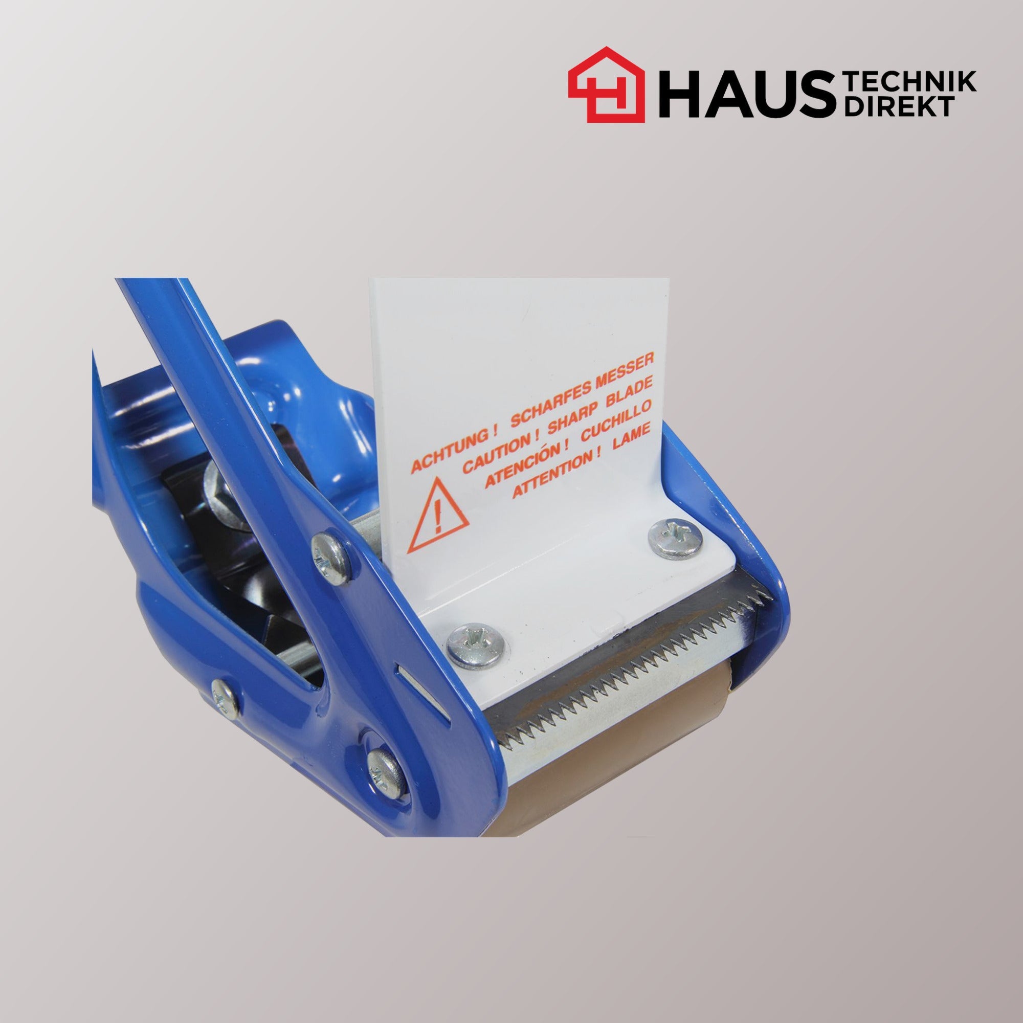 Detailansicht der gezahnten Abrisskante des Handabrollers mit Warnhinweis Scharfes Messer
